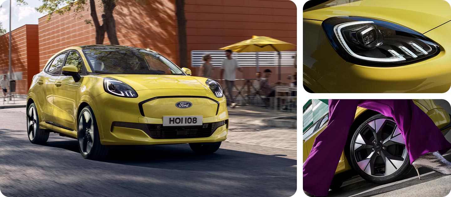 Ford Puma Gen-E in Gelb. Dreiviertelansicht, fahrend durch eine Straße. Detailansicht des Scheinwerfers und der Felgen.