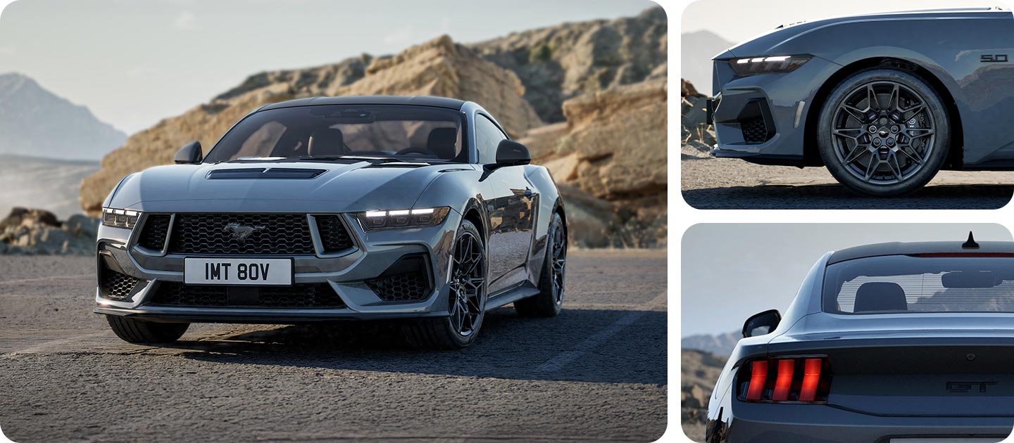 Ford Mustang GT mit Nite Pony Styling-Paket in Grau. Frontansicht, fahrend auf einer unebenen Straße. Detailansicht des Hecks und der Leichtmetallräder.