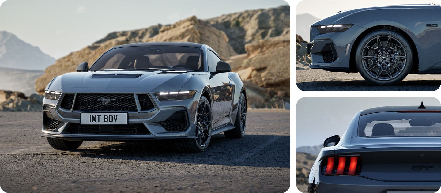 Ford Mustang GT mit Nite Pony Styling-Paket in Grau. Frontansicht, fahrend auf einer unebenen Straße. Detailansicht des Hecks und der Leichtmetallräder.