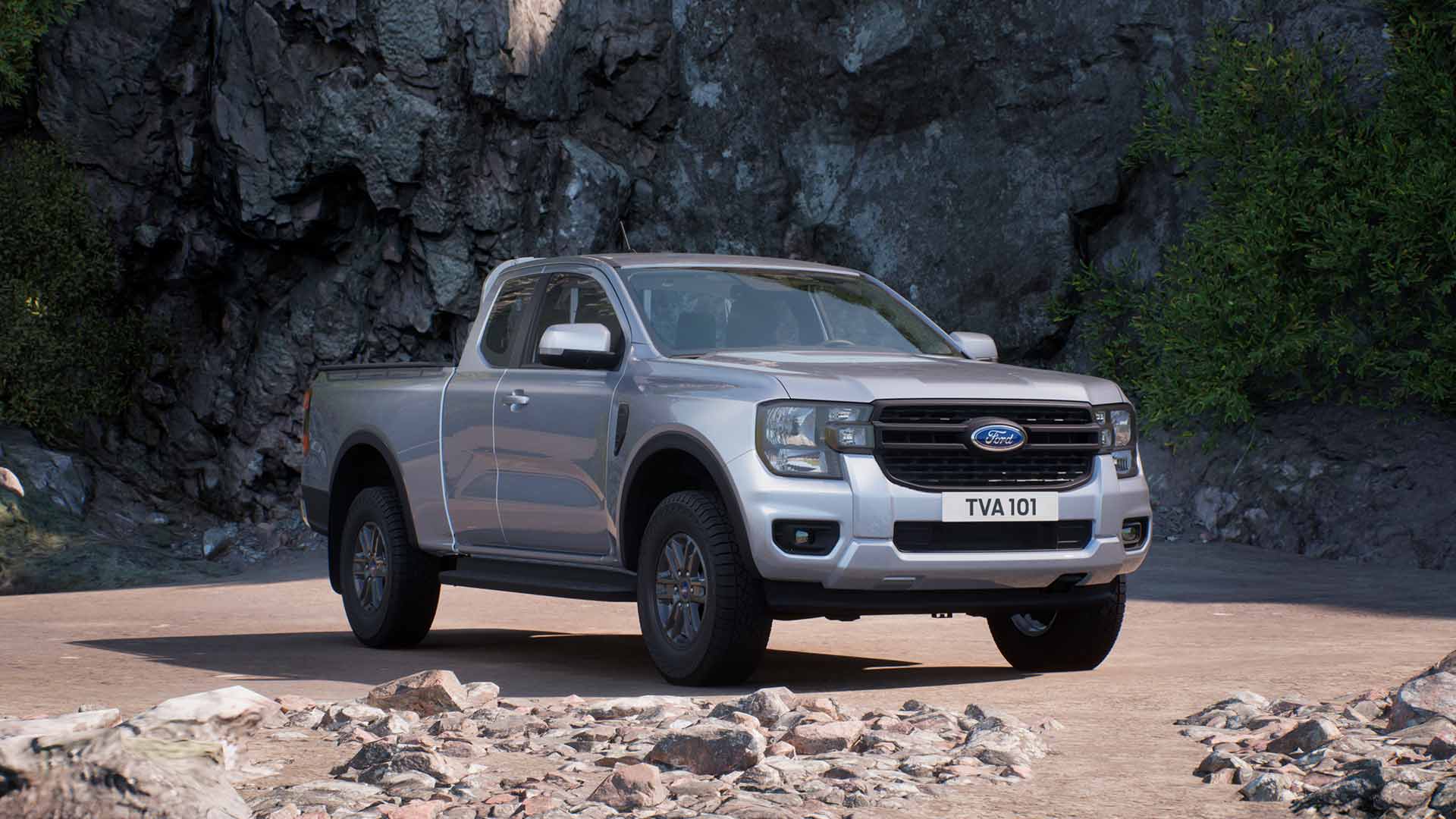Ford Ranger Extrakabine in Silber. Dreiviertelansicht, parkend vor einer Felswand.