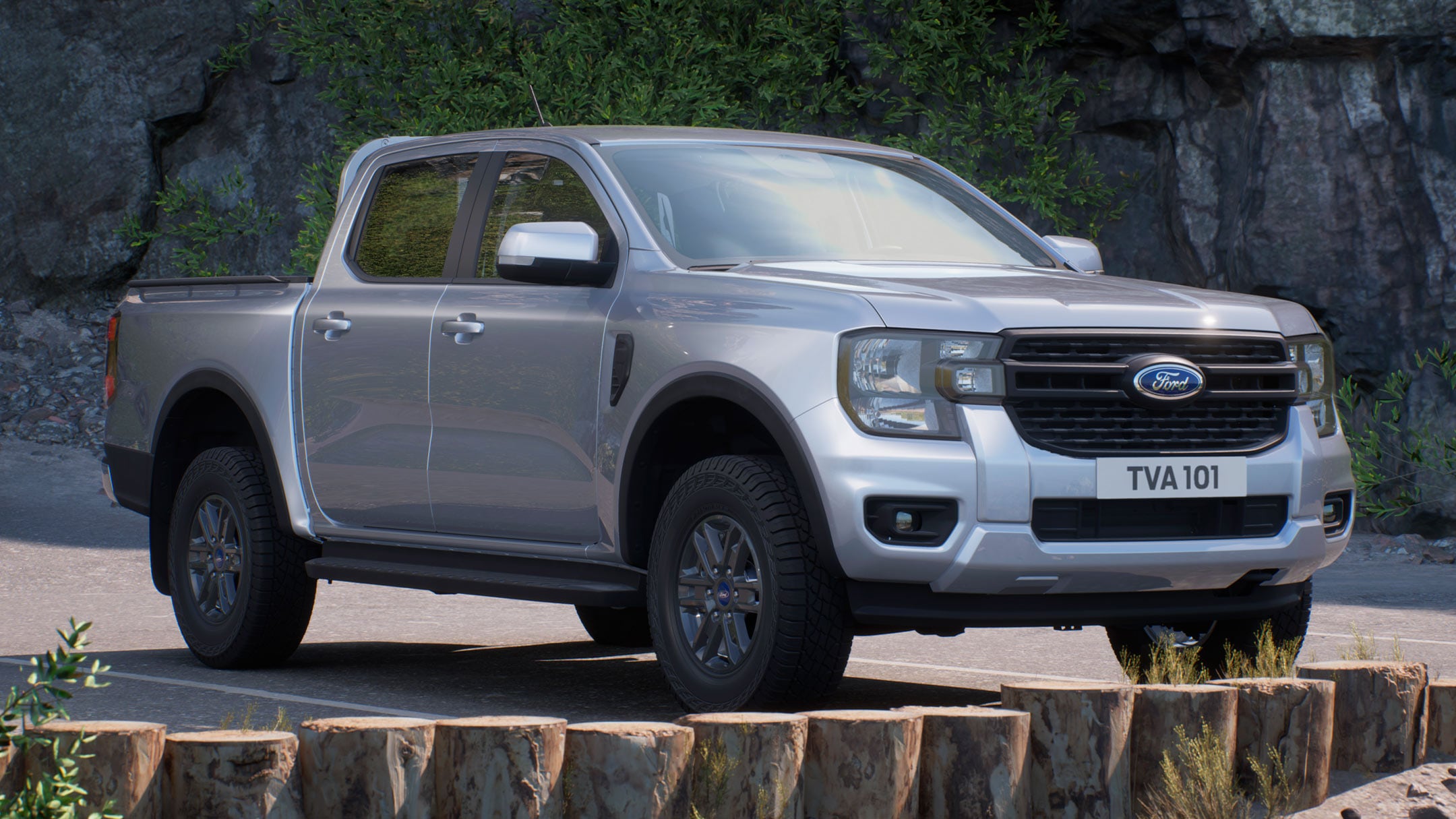 Ford Ranger in Silber. Dreiviertelansicht, parkt auf Parkplatz im Gebirge